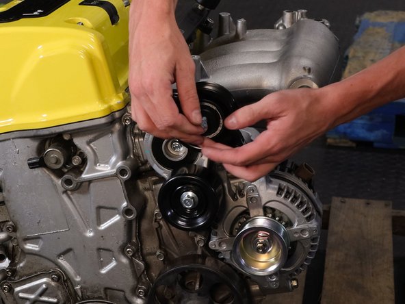 Align the logo and use the supplied bolt.