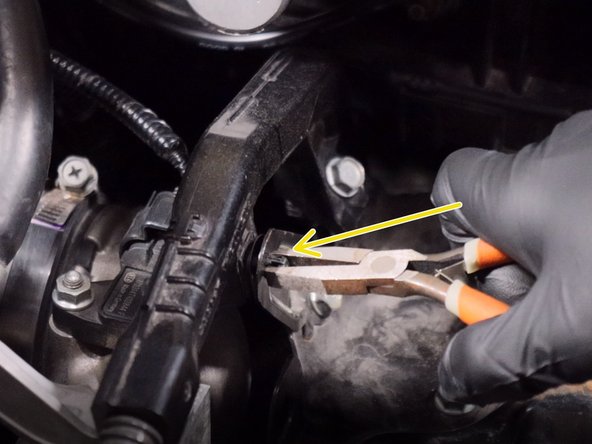 Unclip the wiring harness from the metal battery bracket.