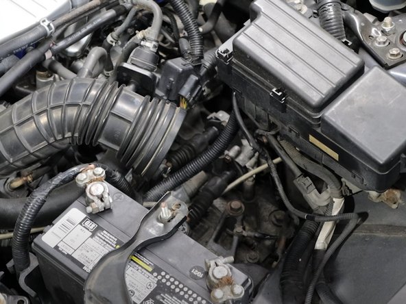 Remove the air filter, or airbox to gain access to the top of the transmission.