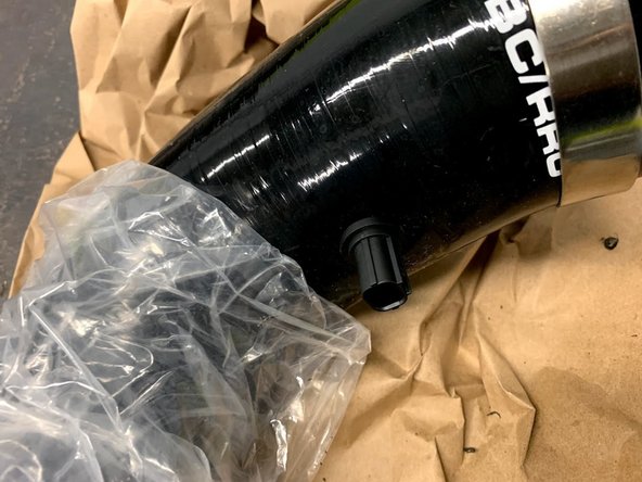 We prefer putting it on the underside or in the back of the tube for a clean, hidden look.