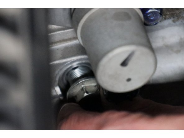 Remove the detent bolt and spring and set aside.