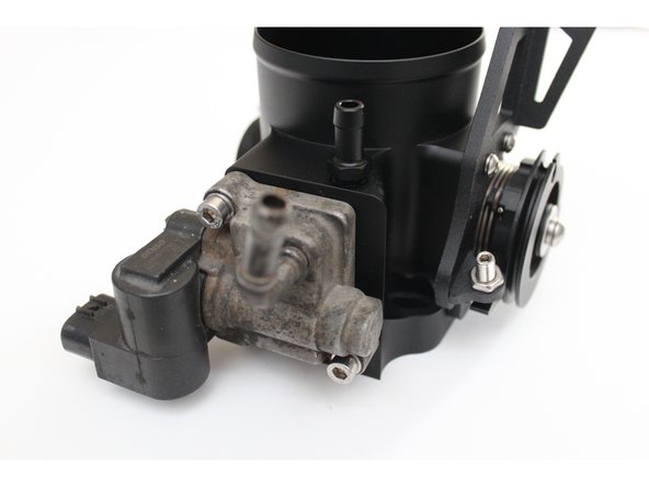 Remove the IACV from your OE throttle body and place it into the machined groove on the lower section of your HR throttle body.