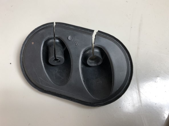 Cut the OEM cable seal down the inner groove to enlarge the opening.