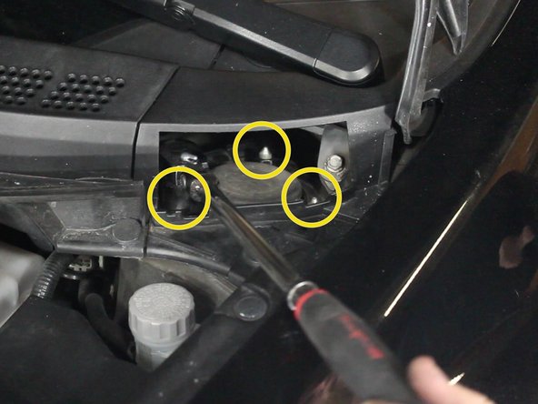 Support the strut before removing these nuts completely as the strut could fall.