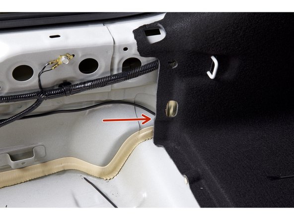 Feed the power harness through the rear trim panel on the driver side.