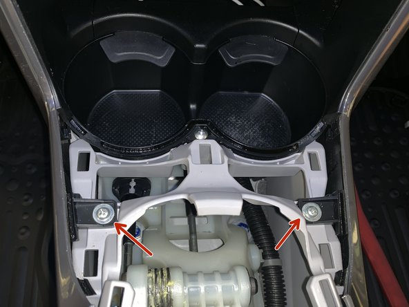 Remove the four screws holding the side trims in place.