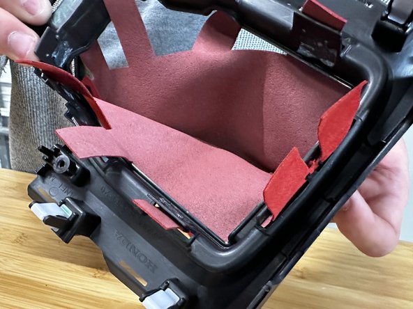 The fabric doesn't need to fit super tight, it just needs to sit in place with all of the tabs through the plastic.