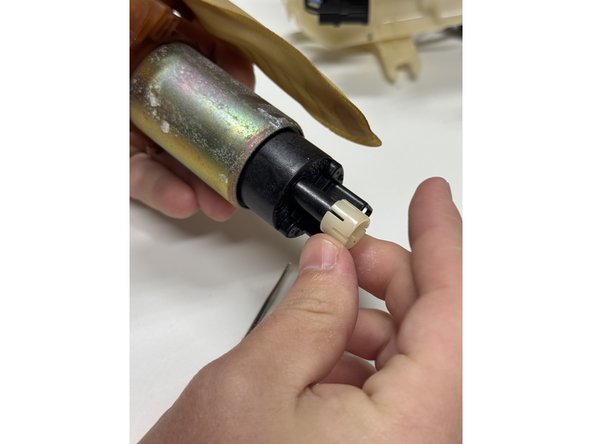 Remove the pump spacer from the factory pump.