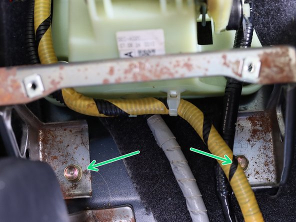 Remove the (x2) 10mm bolts holding the center support bracket in place.