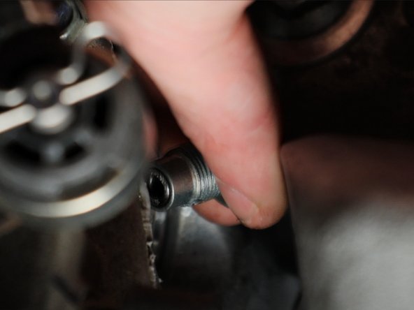 Remove the detent bolt and spring and set aside.