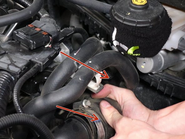 Loosen the air inlet tube and remove it. Be sure to move the hoses out of the way.