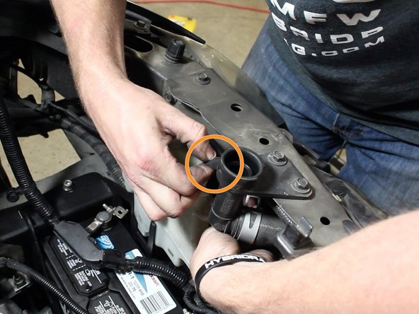 Re-install the overflow tank tube.