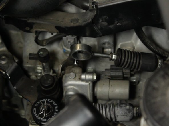 Install the Hybrid Racing bushing, logo facing outward.