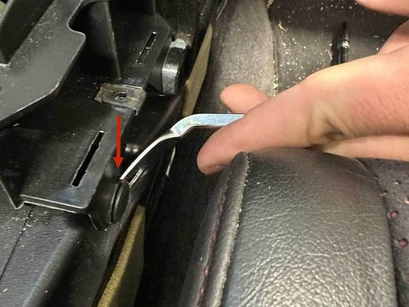 Using a panel popper, remove the clips that hold the AC vent in place.