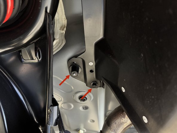 There are clips in the wheel wells as well as bolts on the inside section near the muffler. Remove all.