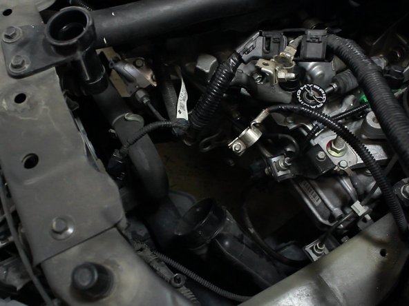 Remove the upper portion of the air intake tube.