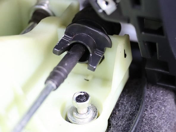 Once it spins, slide it upwards removing it from the shifter.