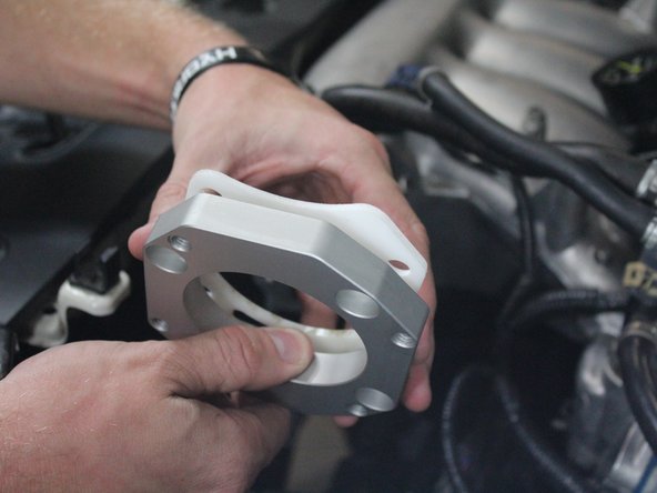 Prepare the RBC gasket and adapter in the correct orientation to fit on the intake manifold.