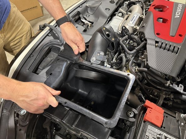Make sure the MAF sensor wiring clears the front of the intake box as you lower it down.