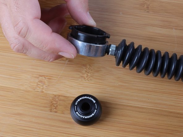 Make sure you have the shifter cable facing the correct way. The tabs that get depressed will face down on the shifter cable. So be sure you slide the outer ring through the top section of the cable.