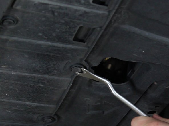 Remove the screws that fasten the bumper to the fender bracket. There is one on each side. You may have to pull back the fender lining to gain access.