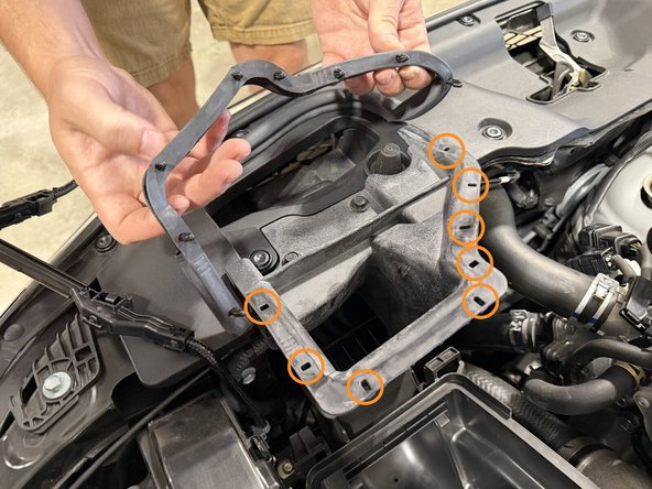 Unclip the rubber air intake seal from the air cleaner base rim. Only free as much as you need to remove the air intake tube.