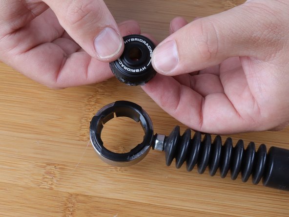 Now that the bushing is lubed, you can insert it back into the bushing the same way it was removed.