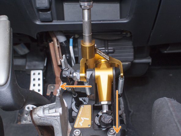 First, loosen the binding nut on the post with the 17mm wrench while holding the post with a 12mm wrench. Next, extend the length of the end-link by threading out the post as illustrated by the orange arrow in the first image.