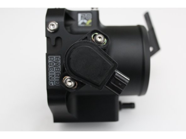 Install the TP sensor and set it so that the mounting bolt is in the center of the TP sensor grooves. Snug them in place so you can calibrate the sensor when installation is complete.
