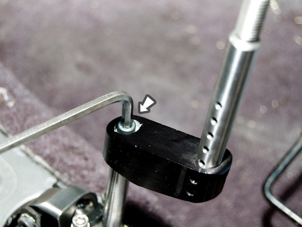 The upper shift rod is already bolted to the aluminum offset block.