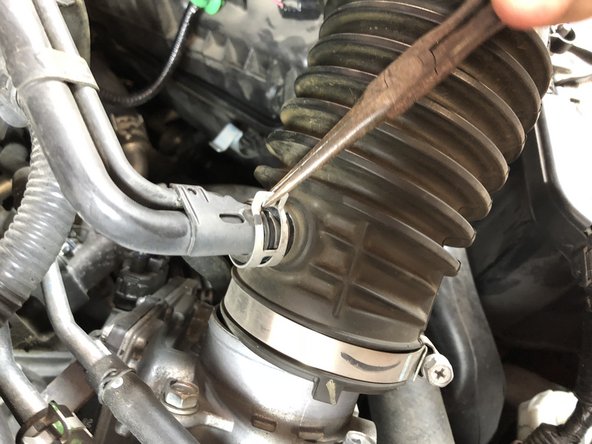 Use pliers to remove the remaining tube on the air intake pipe.