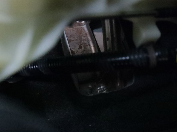 Unbolt the front lower bracket and remove the plastic AC duct.