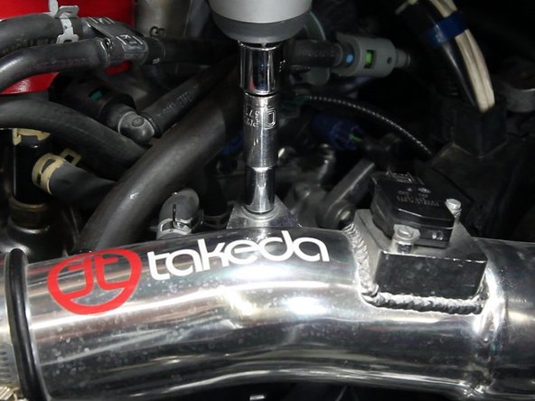 Unplug the MAF sensor and remove any bolts holding the top section of the intake in place.