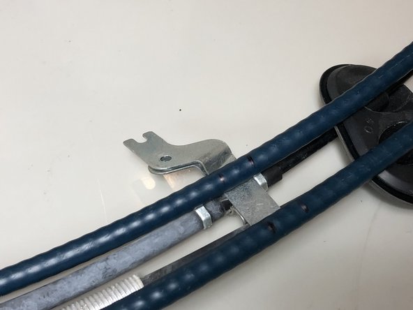 With the cables side-by-side, line each cable up and mark the location of the bracket. This will be used to transfer the bracket to the proper location on the new cable.