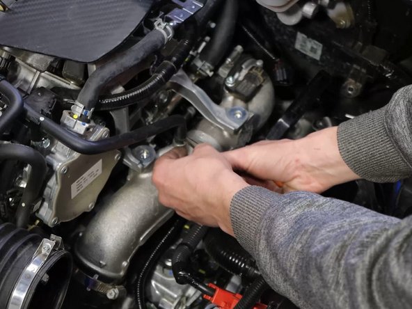 There are a number of bolts, two hose clamps and an electronic connector to remove.