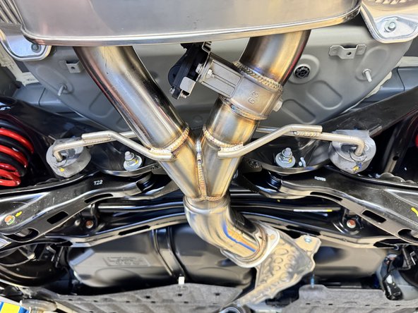 Using the OEM hangers, install the rear HR exhaust section.