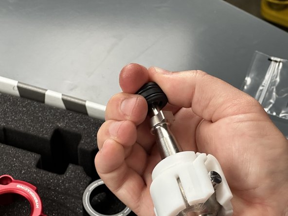 Locate the Shifter Ball Cup (#7) and snap it in place. This part should spin smoothly and freely.