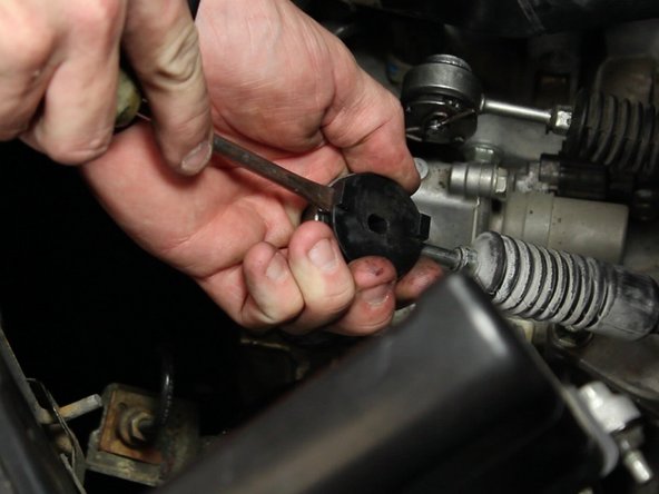 With a flat tip screw driver, pry the metal insert out of the OEM rubber bushing.