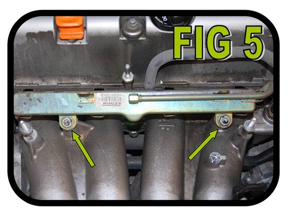 Using a 12mm socket, remove the two (2) nuts holding the fuel rail on and pull the fuel rail off the intake manifold as illustrated in FIG 5. Note: All 4 injectors will likely come out with the fuel rail.