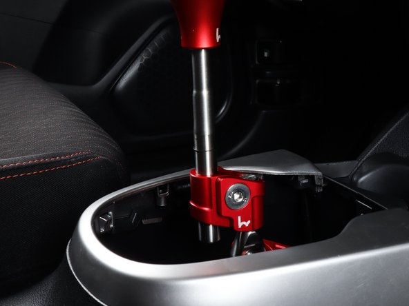 You can remove the shift boot and leave the shifter exposed, or you can retain it and slide the boot over the rod.