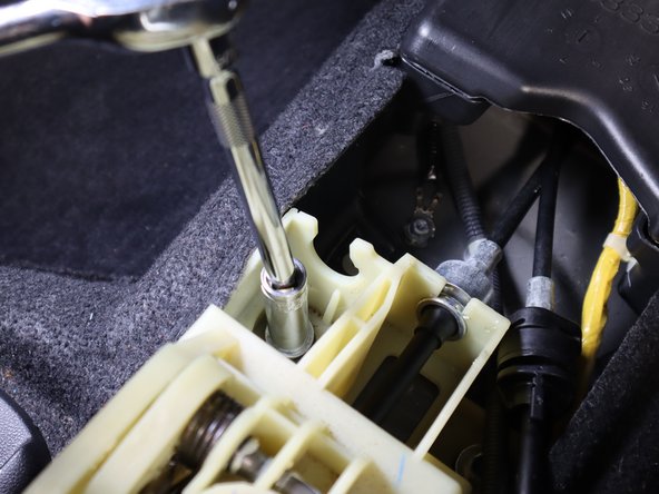 Remove the Front Left bolt from the shifter assembly.