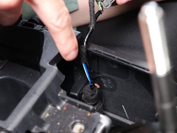 Unclip the inner wire harness inside of the console.