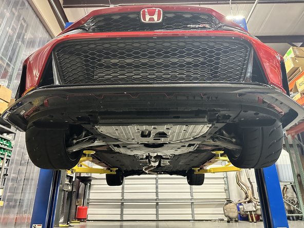 The screw holes will not be visible if the lip is removed.