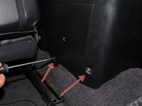 On the rear section of the console, locate the 4 mounting screws.