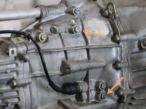 The 1/2 gate has two specific detent springs that affect the engagement force. One on the upper section of the trans case, and one near the bottom RH side of the case. These are marked in orange.