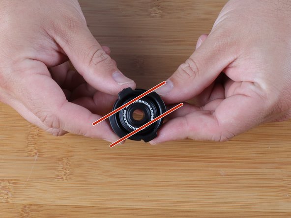 The new Hybrid Racing bushing comes pre-assembled in the package. You must remove the center bushing before installing it in the shifter cable end ring.