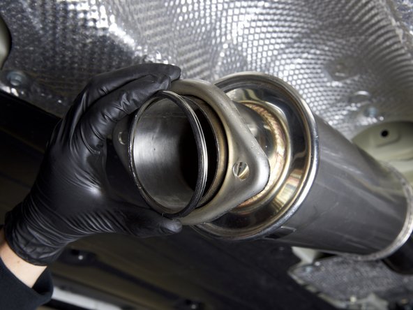 Install the supplied ring gasket onto the rear section of the B-pipe (mid-pipe) already installed on the car.