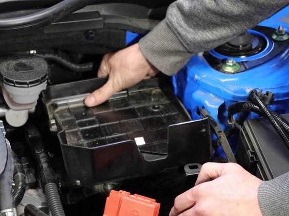 Remove the battery, protective padding, and then plastic undertray.