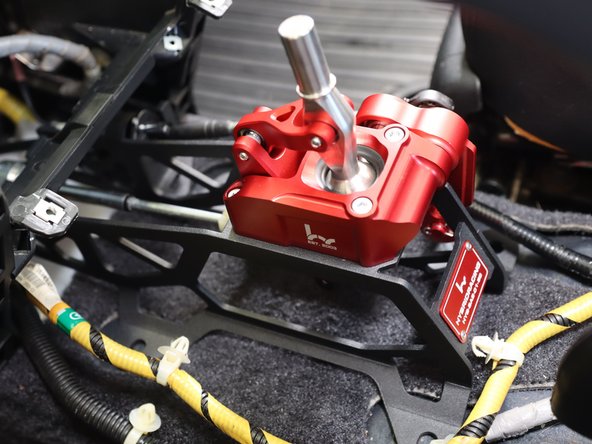 Install the shifter cables on the HR shifter. You may need to push the cables forward into the floor seal. That is normal.