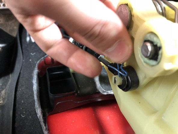 Locate the LH side shifter cable end and remove the clip holding it place. Slide the cable end off the shifter.